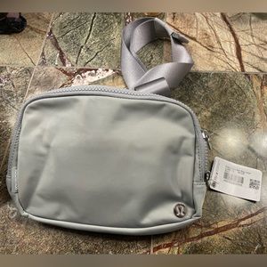 Brand new with tags Lululemon everywhere belt bag large size.  Silver.